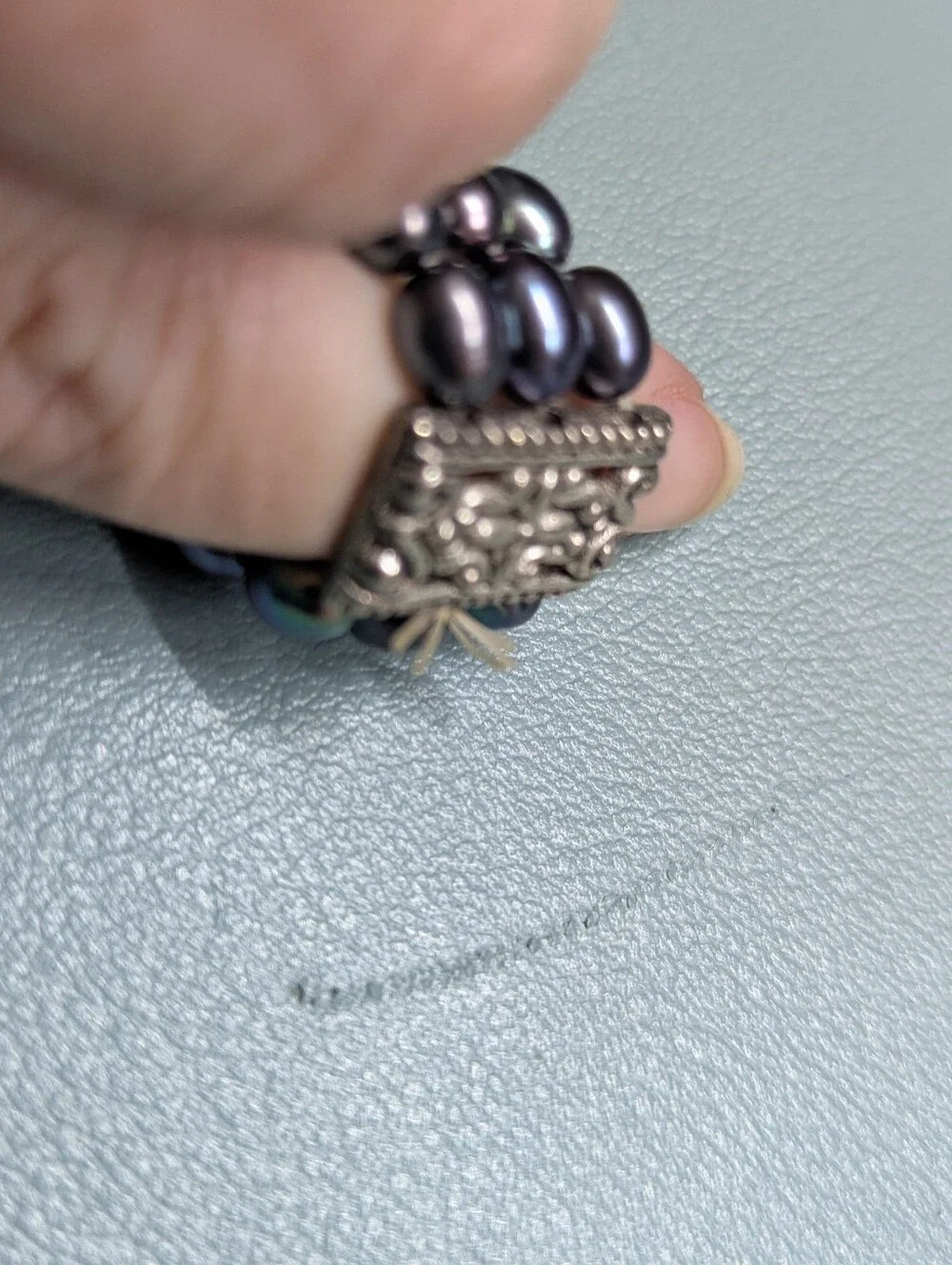 Multi-Strand Black Pearl Bracelet with Ornate Silver Accents